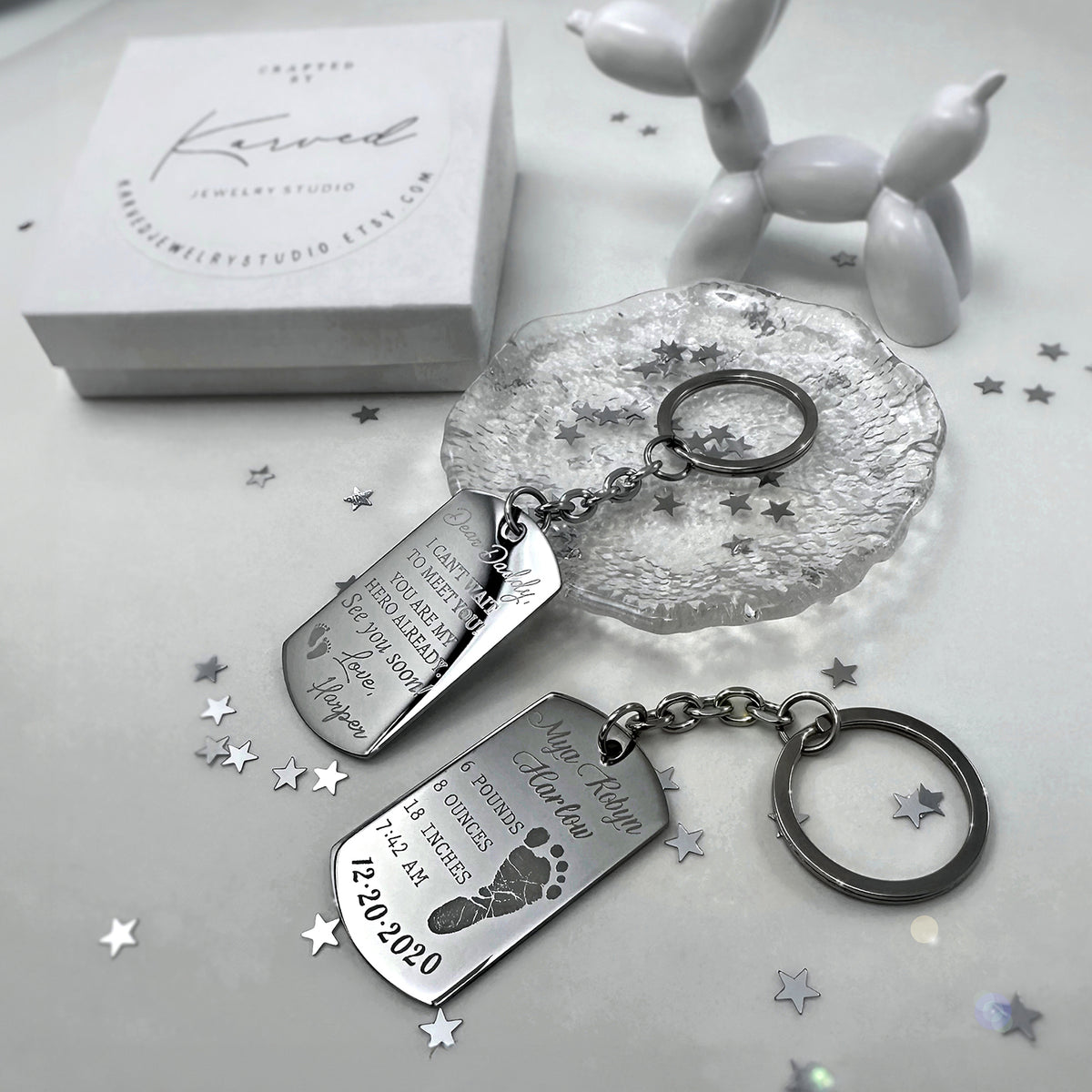 Baby keepsake dog tag keychain gift set showing custom photo, footprint, birth details, and heart and round keyring options
