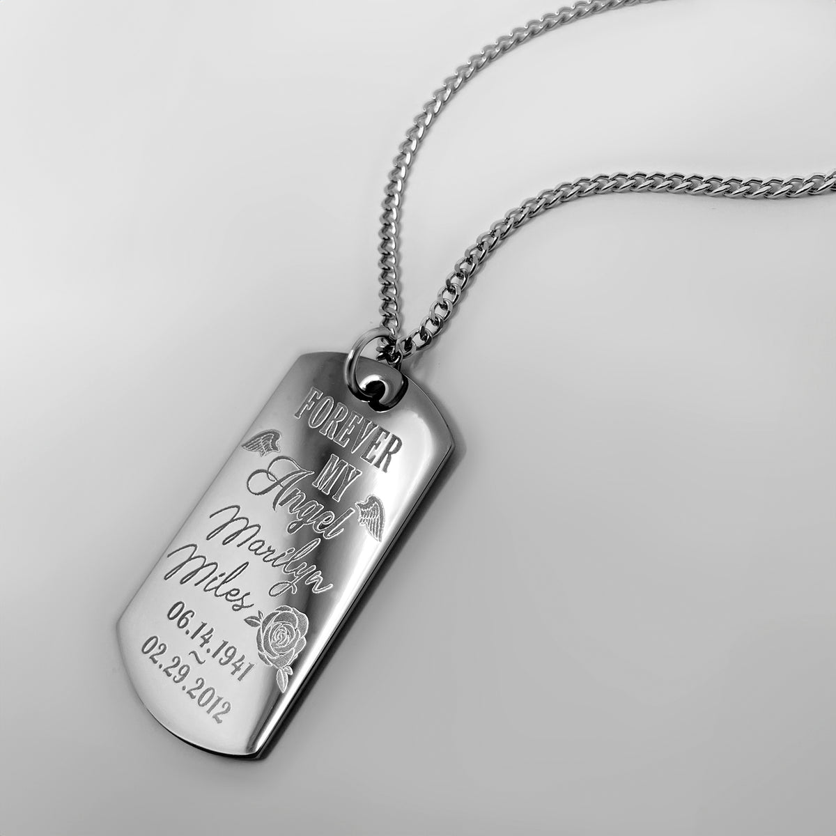 Angel memorial dog tag necklace close-up engraved with name, memorial dates, rose, and “Forever My Angel”
