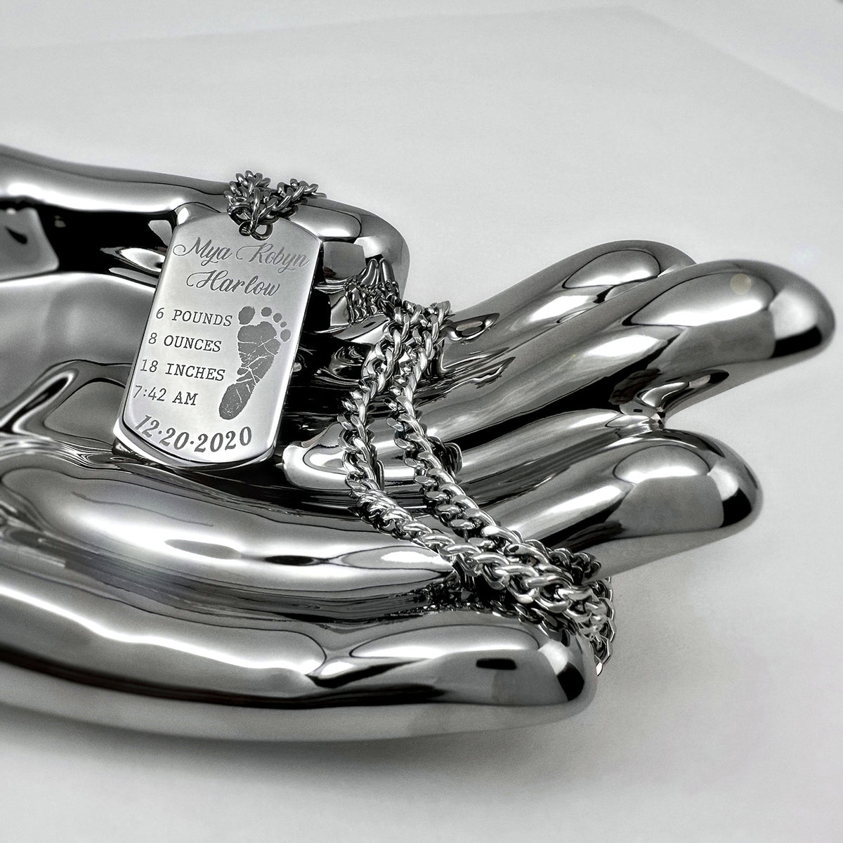 Personalized baby dog tag necklace with custom footprint, name, birth date, weight, length, and birth time engraving