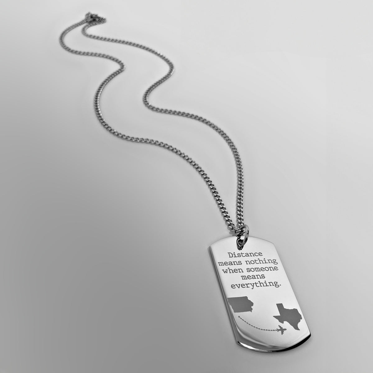 Custom dog tag necklace for a long-distance relationship with personalized distance details like custom state outlines and a quote
