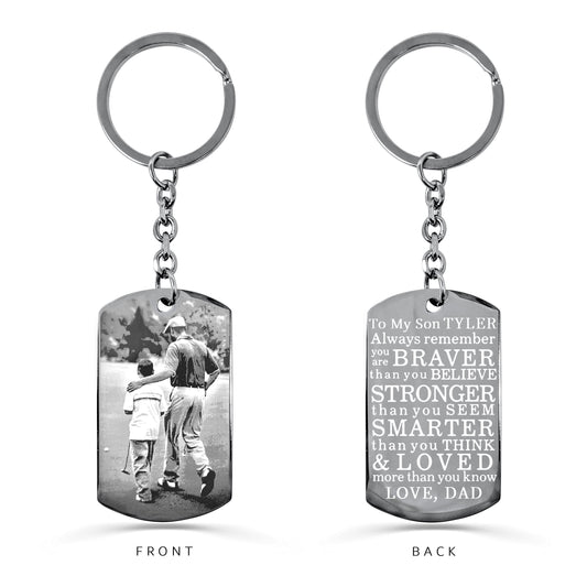 Personalized Dad to son dog tag keychain with round keyring, custom father-and-son photo on the front, and “braver, stronger, smarter and loved” message on the back