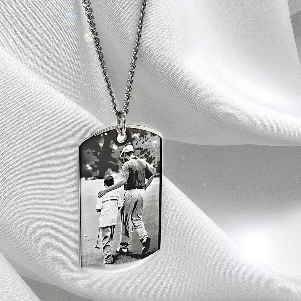 Custom father and son photo dog tag necklace displayed on satin with personalized Dad message