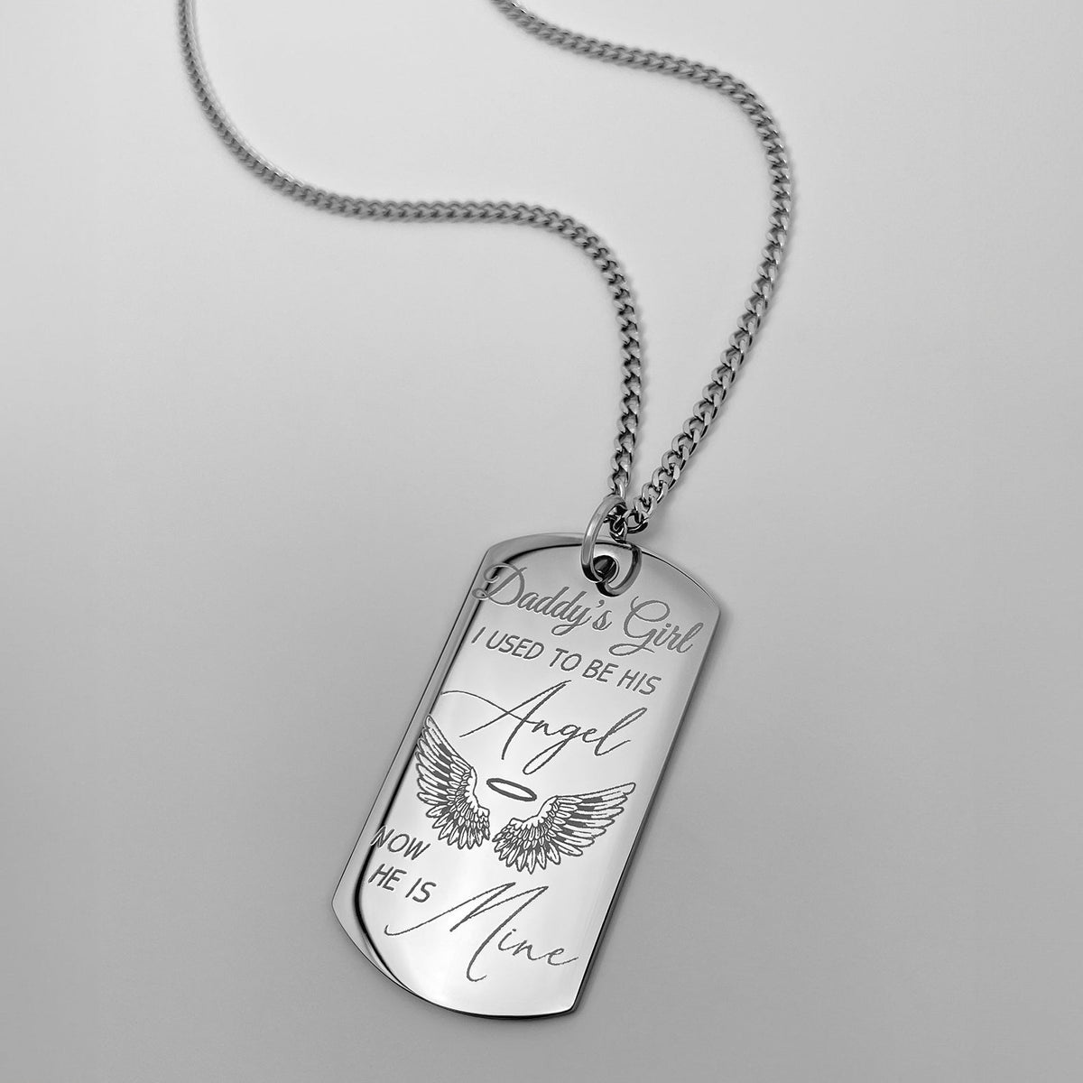 Close-up of custom Daddy’s Girl dog tag necklace with angel wings and “I used to be his angel, now he is mine” message
