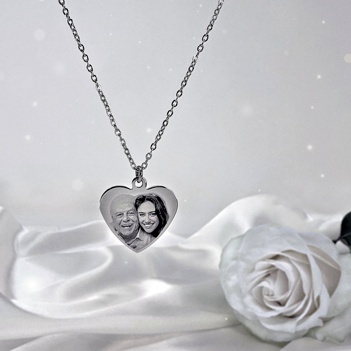 Custom Dad picture memorial heart necklace displayed on satin with personalized portrait engraving