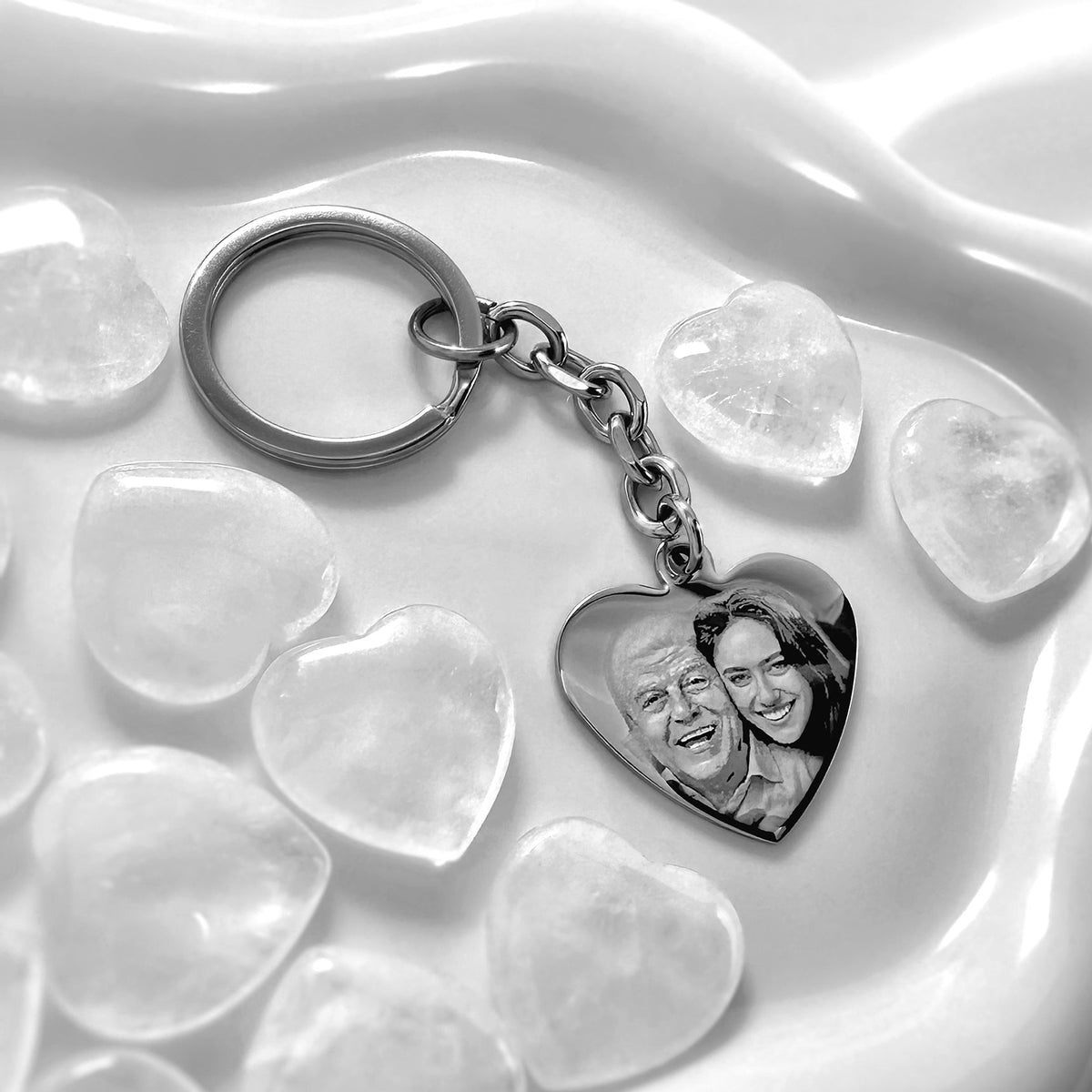 Custom father and daughter photo heart keychain displayed on a glass dish