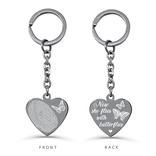 Personalized fingerprint memorial heart keychain with butterfly design and “Now she flies with butterflies” engraving on the back