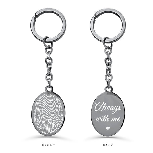 Custom engraved fingerprint oval keychain showing fingerprint engraving on the front and “Always with me” message on the back