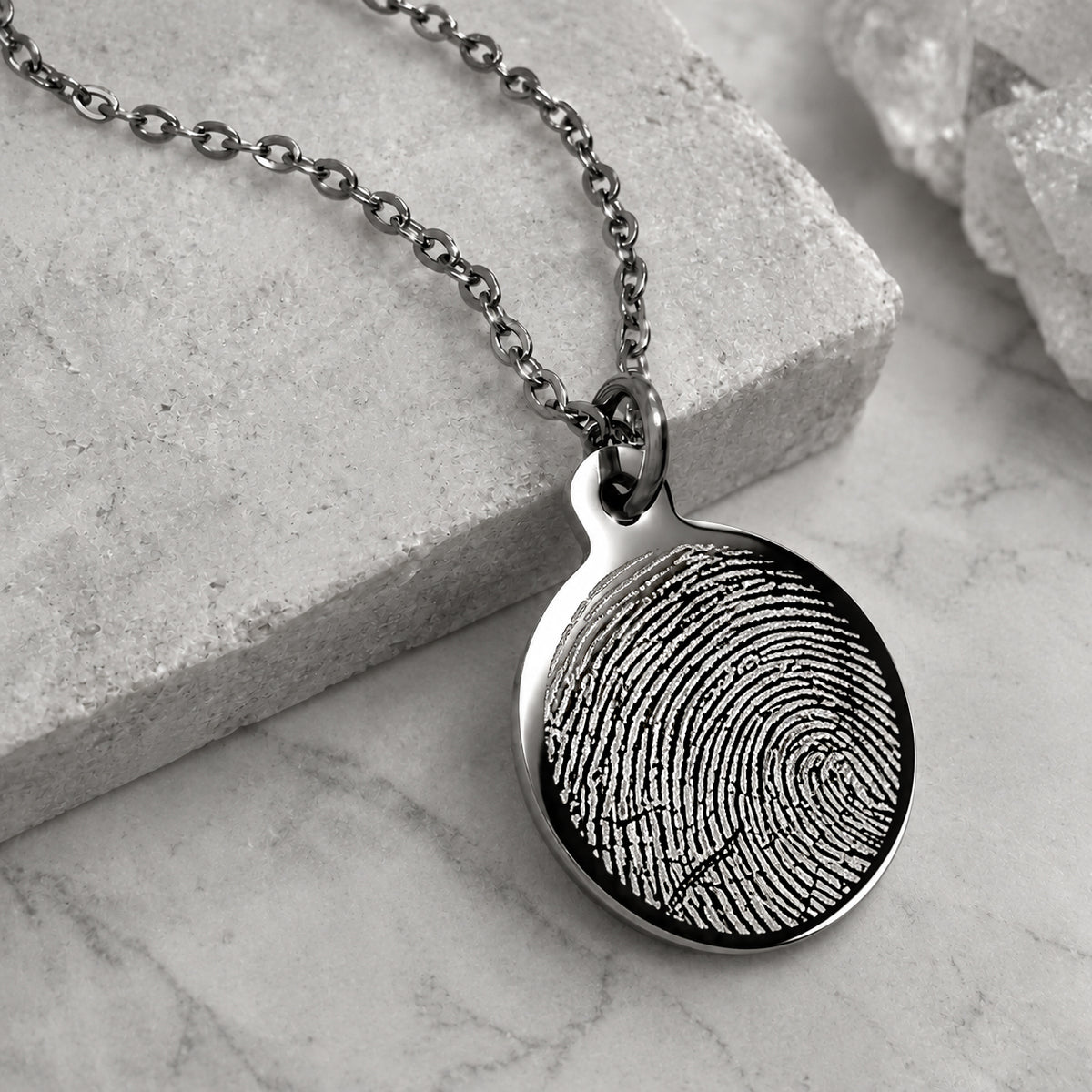 Custom fingerprint engraved on a round stainless steel pendant necklace