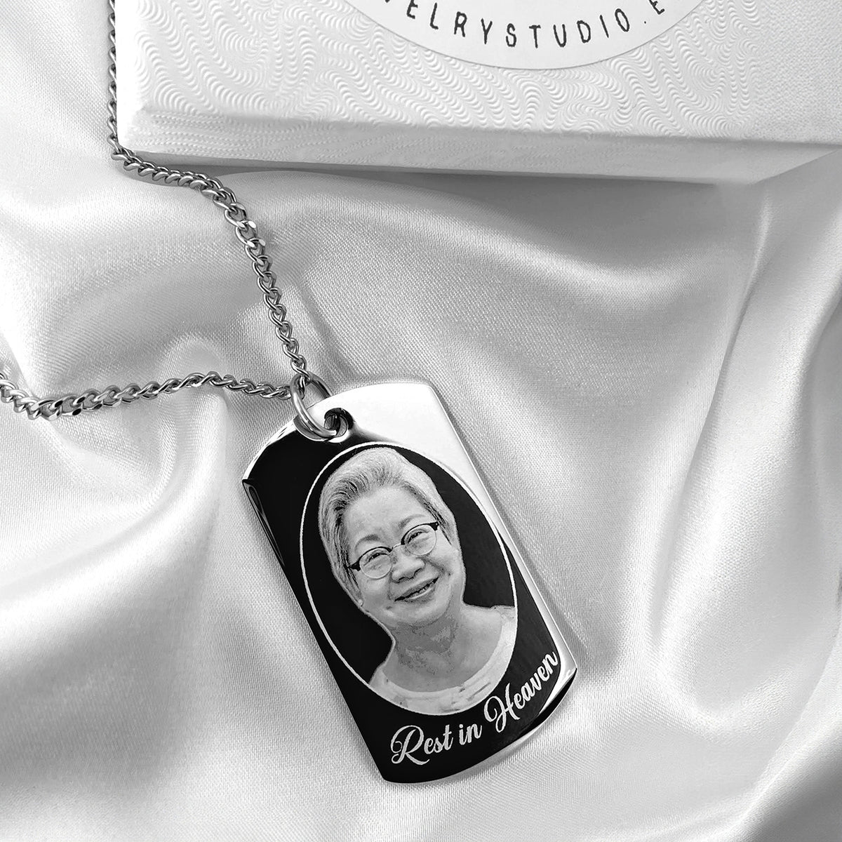 Custom Grandma photo memorial dog tag necklace displayed on satin with “Rest in Heaven” engraving