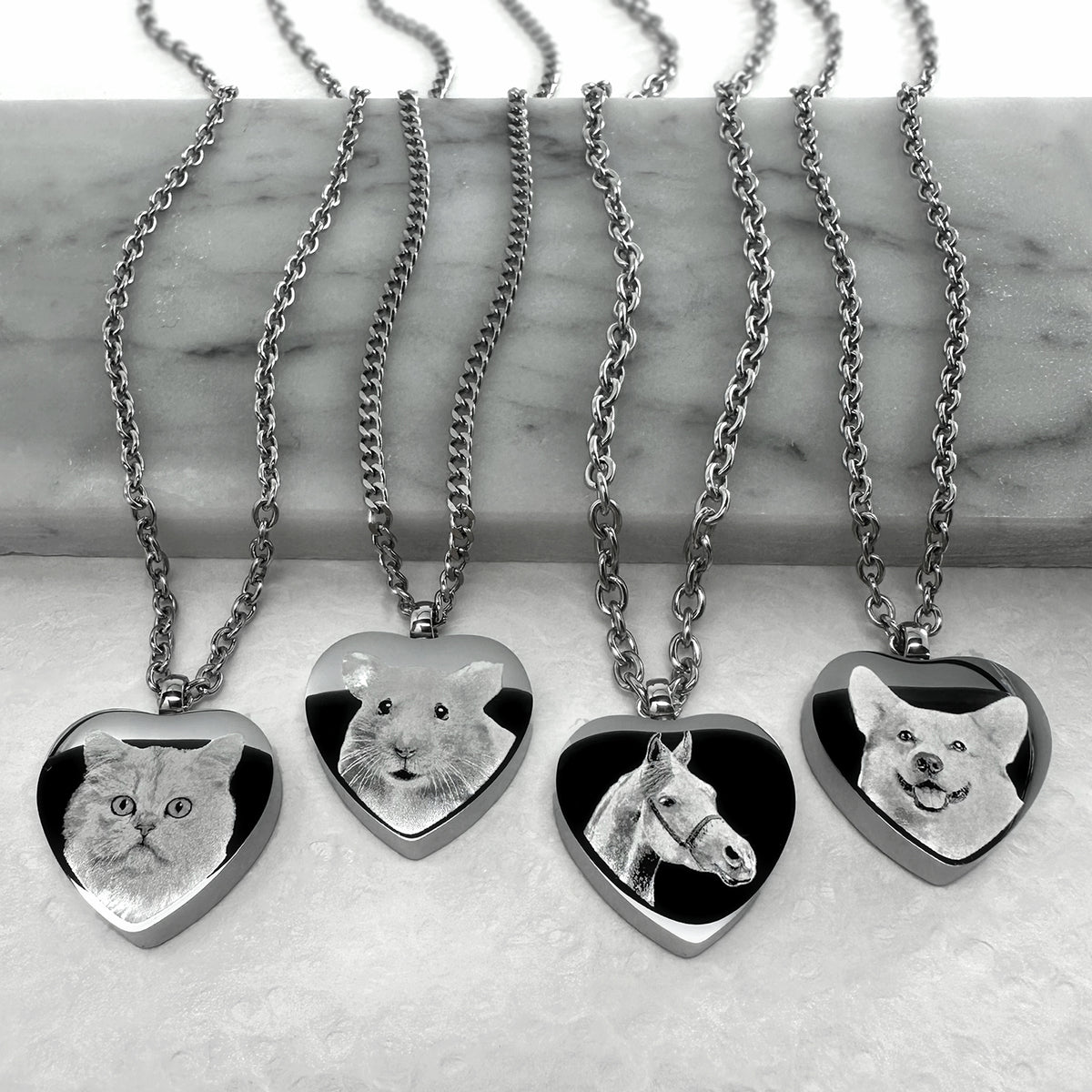 Collection of personalized photo engraved pet portrait heart urn necklaces on stainless steel chains