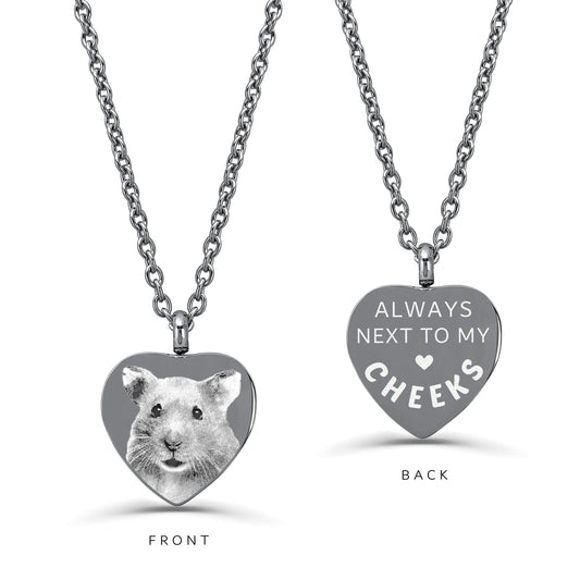 Custom guinea pig portrait engraved on the front of a heart-shaped memorial urn necklace with personalized message on the back