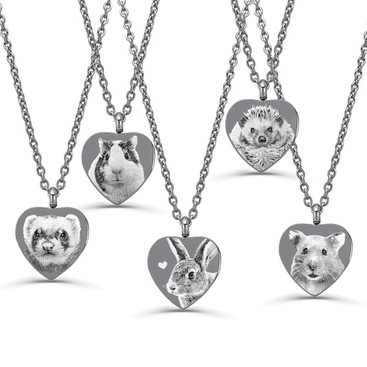 Five heart-shaped urn pendant necklaces on silver chains, each featuring a different animal portrait engraving including a ferret, guinea pig, hedgehog, rabbit, and hamster, displayed on a clean white background.