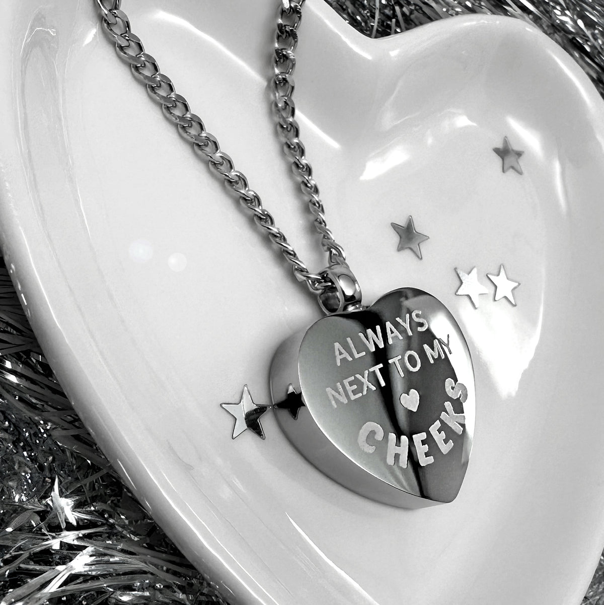 Heart-shaped memorial urn necklace with personalized remembrance message engraving