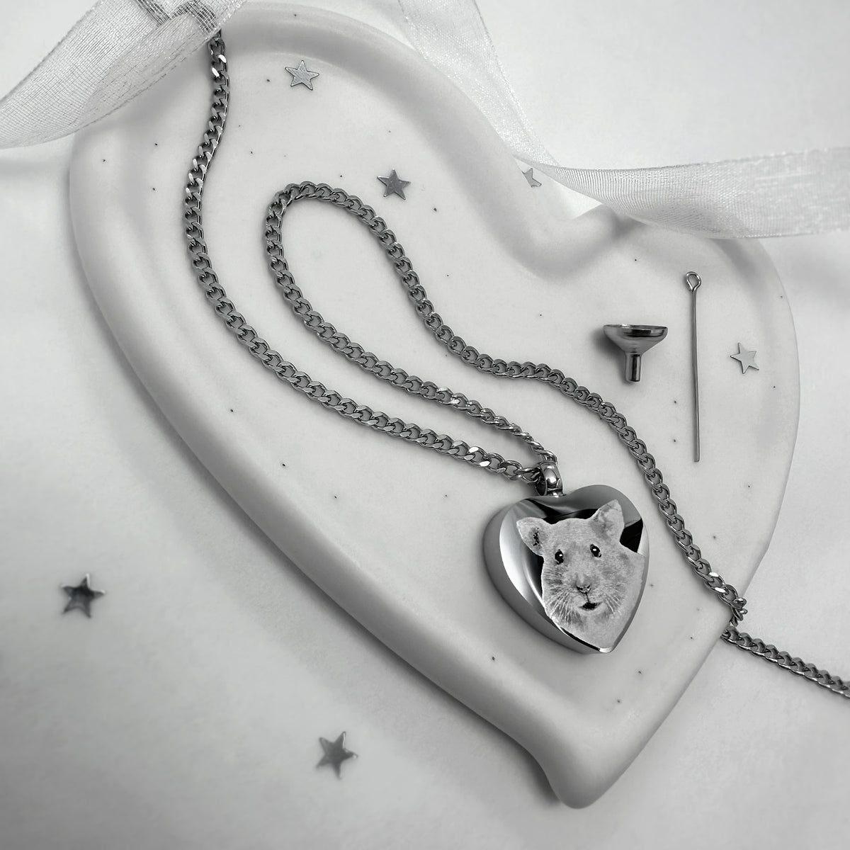 Custom hamster portrait engraved on a heart-shaped stainless steel memorial urn necklace