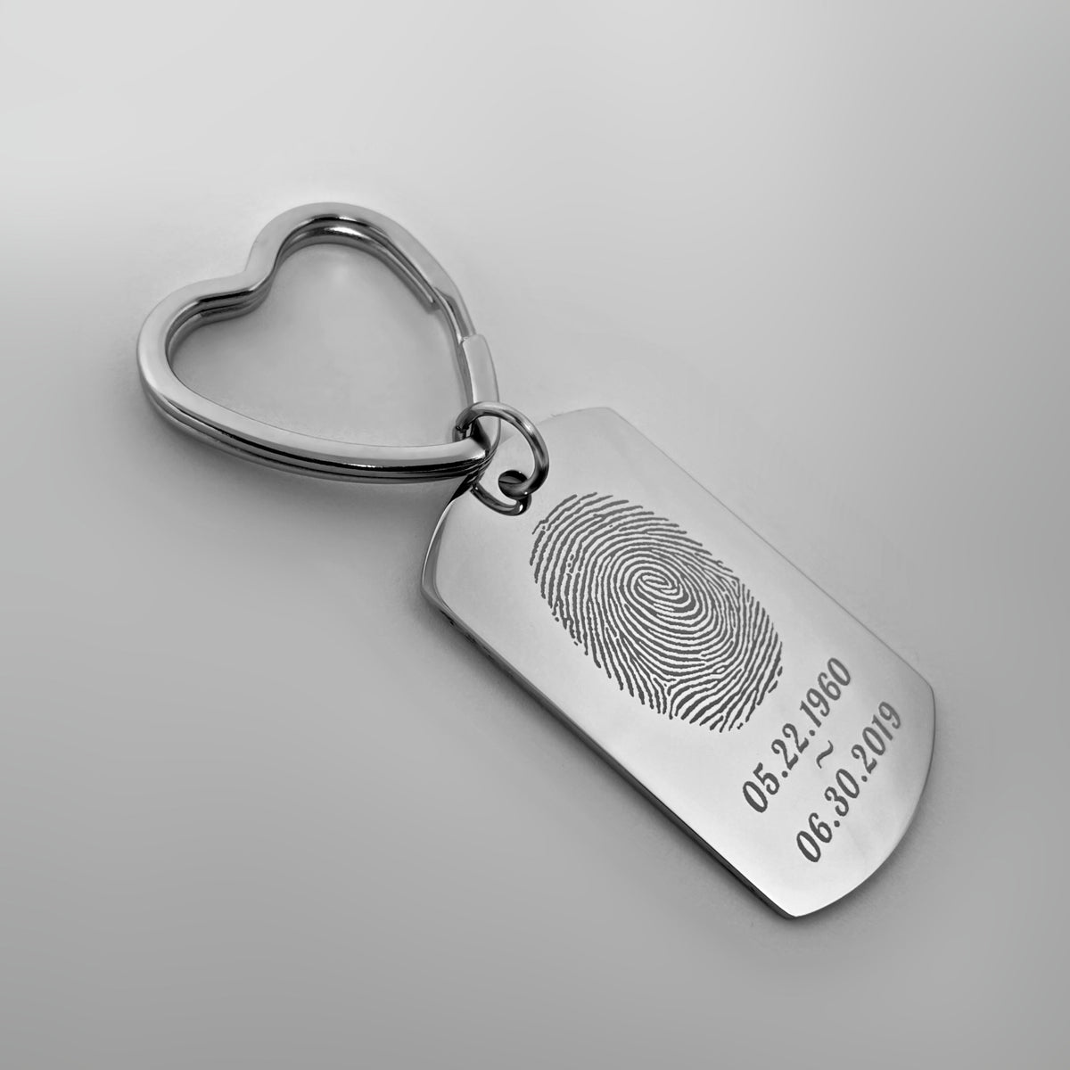 Custom fingerprint memorial dog tag keychain with heart-shaped keyring and personalized dates