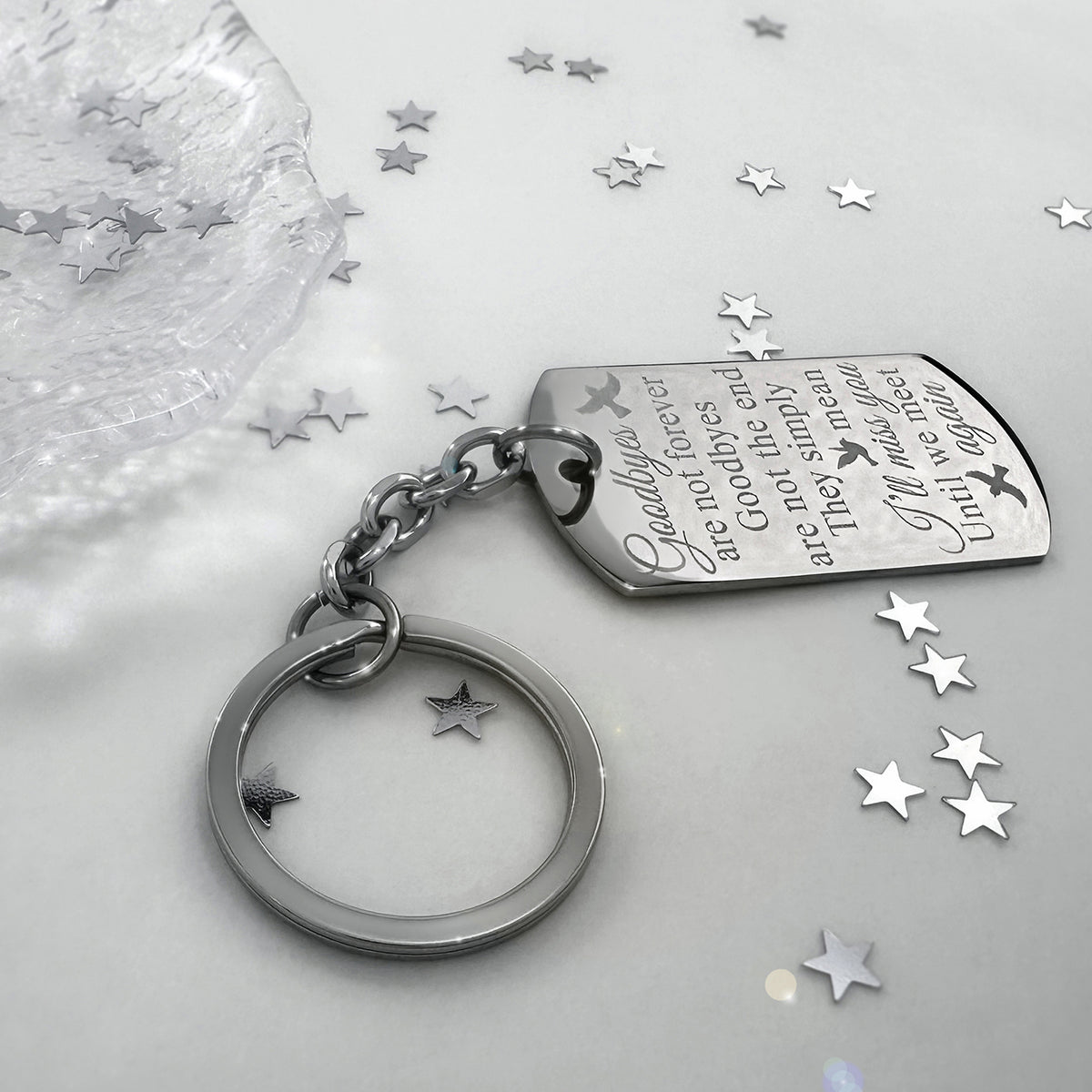Memorial dog tag keychain displayed with star accents and engraved “I’ll miss you until we meet again” message