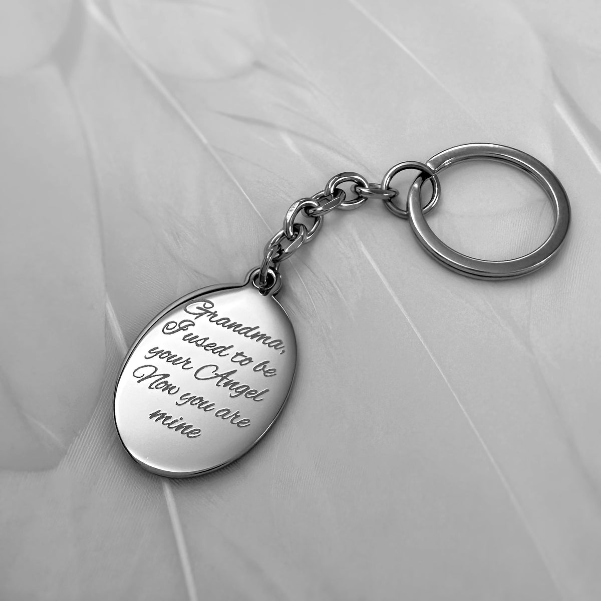 Personalized memorial oval Grandma keychain with custom memorial message "I used to be your Angel, now you're mine" engraved on the back