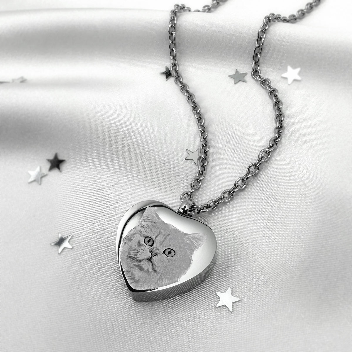 Custom cat portrait engraved on a heart-shaped stainless steel pet memorial urn necklace