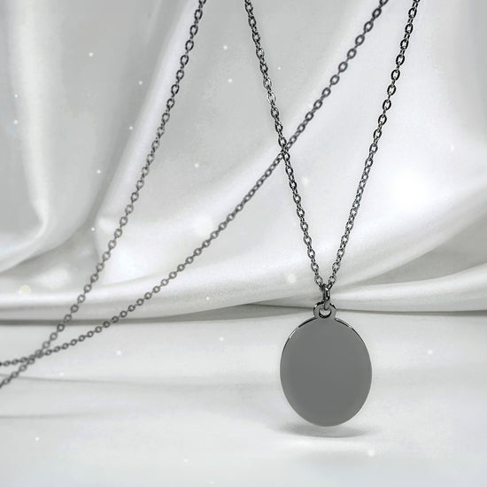 Personalized Grandma memorial oval necklace video showing grandmother and granddaughter photo engraving on the front and “I used to be your angel, now you’re mine” engraved on the back