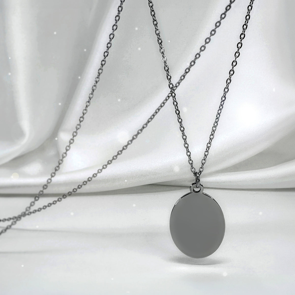 Personalized Grandma memorial oval necklace video showing grandmother and granddaughter photo engraving on the front and “I used to be your angel, now you’re mine” engraved on the back