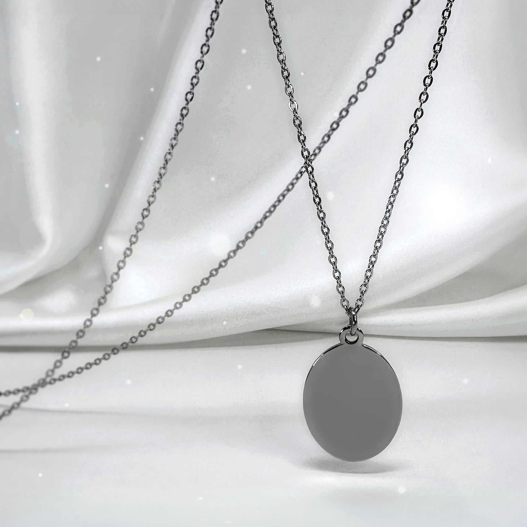Personalized Grandma memorial oval necklace video showing grandmother and granddaughter photo engraving on the front and “I used to be your angel, now you’re mine” engraved on the back