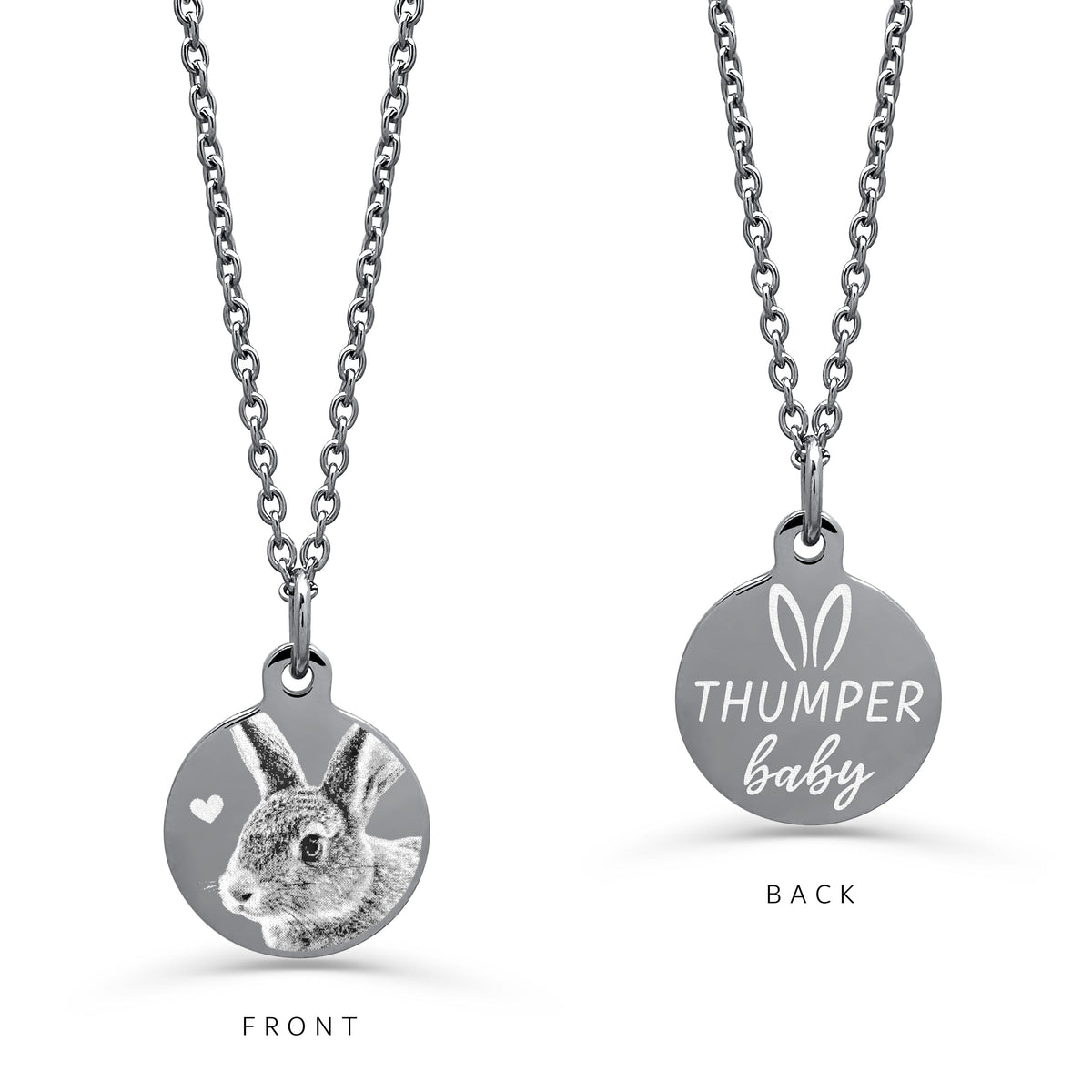 A silver round pendant necklace on a white background, displaying FRONT and BACK engraving design. The front shows a detailed personalized bunny rabbit portrait with a small heart, and the back shows the text custom name design with bunny ears at the top.
